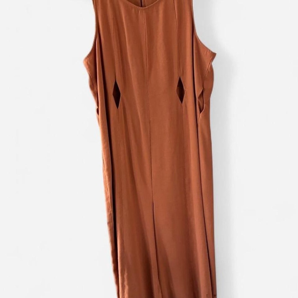 BCBG Generation orange jumpsuit with diamond bodice cutouts Size M